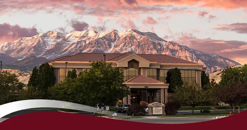 Riverwoods medical building in Provo with mountain backdrop at sunset